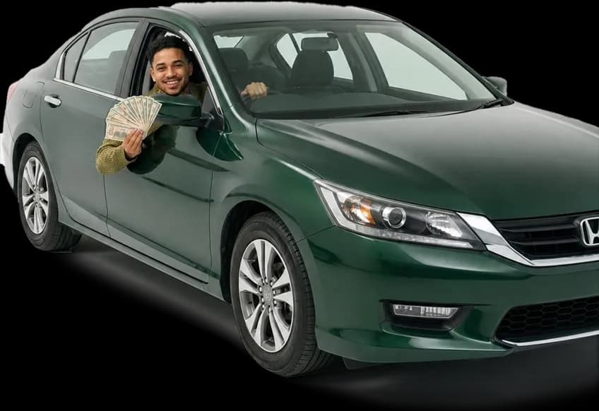 Male customer inside his green car